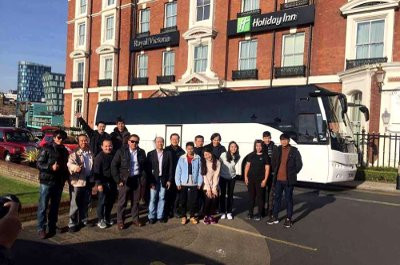 Happy group enjoying a Coach hire trip in Nuremberg